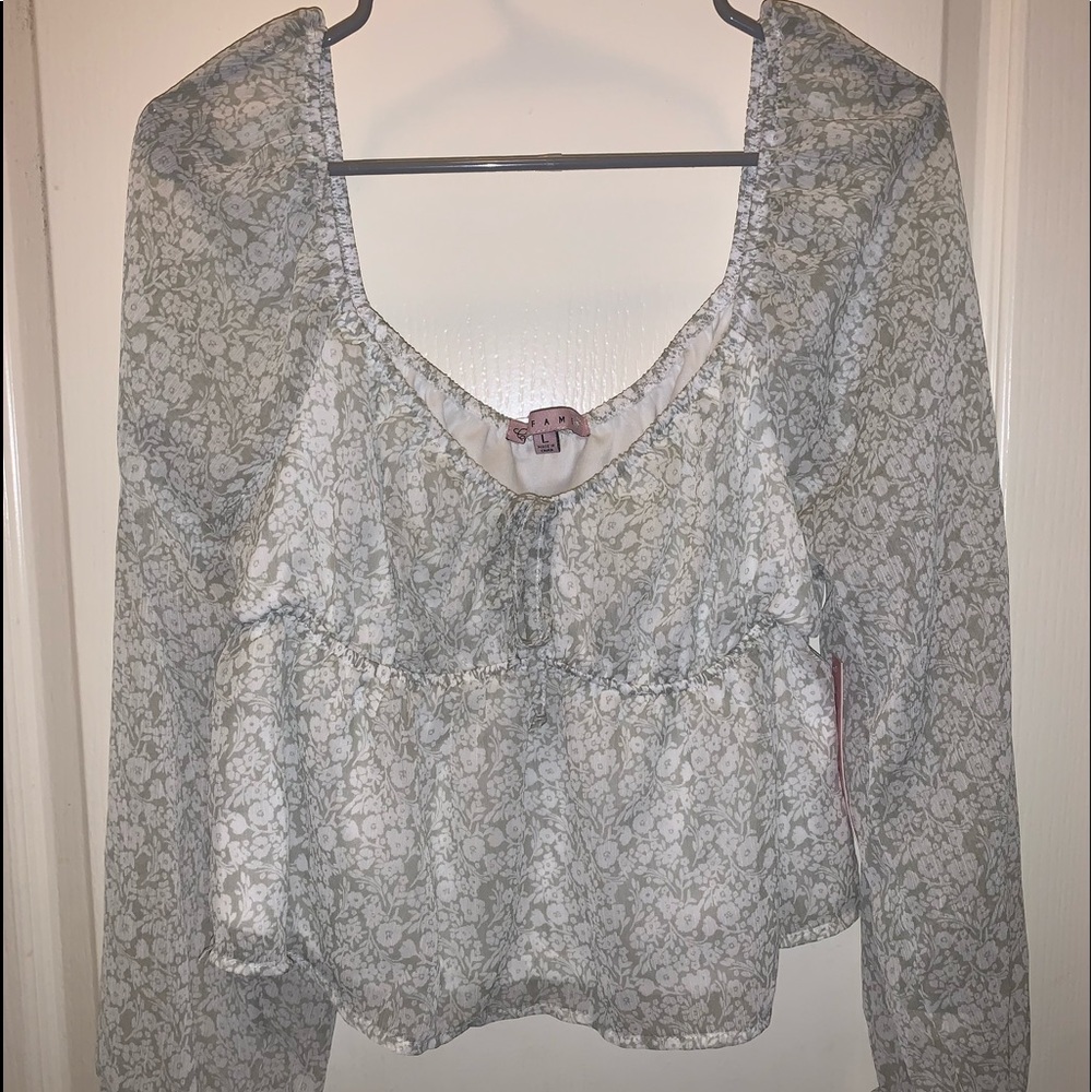 light green flower printed top. Size Large. Never worn and still has tags.